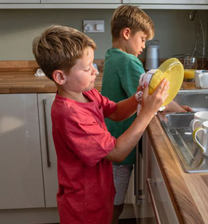 Child cleaning window