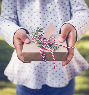 girl giving present