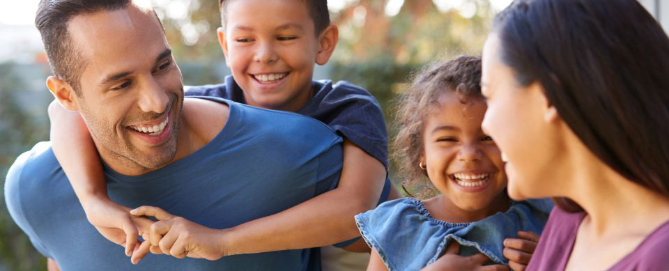 family hugging and smiling